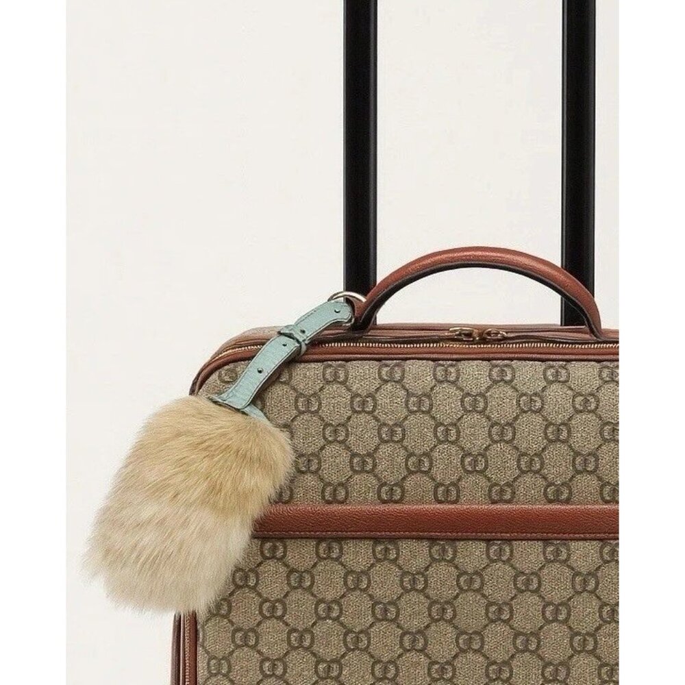 Stylish Designer Luggage with Fur Charm Tag on Handle